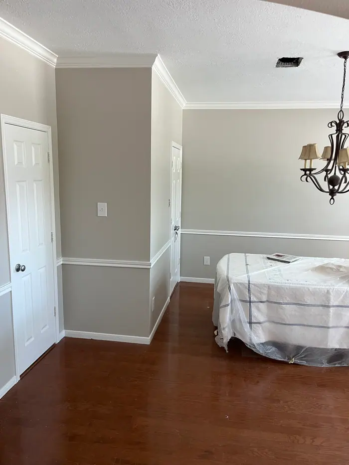 Freshly painted interior room with protected furniture